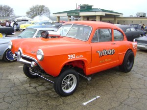 This car is easily identified as a gasser because of it's "nose high" stance and slicks. The name, "Wicked" also is a nod to vintage race cars often being named. The hood scoop and lack of billet rims are also both good indicators that this is a gasser.