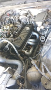 Headers after they have been cleaned and repainted, and re-installed. Don't they look so much nicer? Also they should not rust away for some time! Disregard the dirty charcoal canister, radiator, inner fender wells and valve covers. 