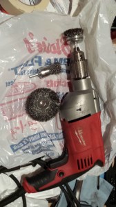 drill and wire wheels used to remove rust