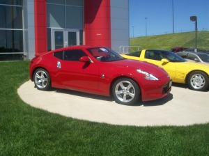 Picture showing the variety of sports cars, Nissan 370Z and an 80's Corvette