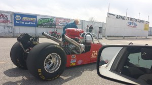 woman prepping her husbands drag car. Does she have a granddaughter?